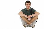 Teenage Student Sitting On Floor Stock Photo
