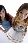 Teenage Students With Book Stock Photo