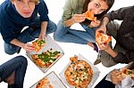 Teenagers Eating Pizza Stock Photo