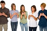 Teenagers Reading Sms Stock Photo