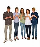 Teenagers reading sms Stock Photo