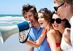 Teenagers Shouting Through Megaphone Stock Photo