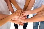 Teenagers With Hands Together Stock Photo