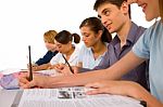 Teenagers Writing On Notebook Stock Photo