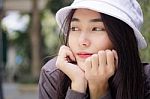 Thai Adult Girl White Cap Gray T-shirt Beautiful Girl Relax And Smile Stock Photo