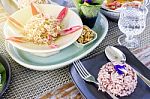 Thai Food Set Menu On Outdoor Table With Orange Sun Glare Stock Photo