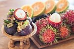 Thai Tropical Fruit On Wooden Table Stock Photo