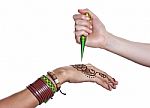 The Process Of Applying Mehendi On A Woman's Hand Stock Photo