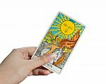 The Sun, Isolate Of Hand Holding Tarot Card Stock Photo