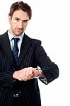 This Is The Right Time! Serious Businessman Stock Photo