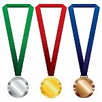 Three Medals Set. Gold, Silver And Bronze On Red Ribbon And Green, Blue Ribbon Stock Photo