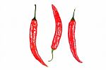 Three Red Peppers Over White Background Closeup Stock Photo