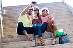Three University Students Taking A Selfie In The Street Stock Photo
