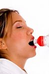 Tired Female Drinking Water Stock Photo