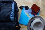 Top View Of  Backpack Bag With Other Travel Accessories On Woode Stock Photo