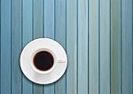 Top View Of Cup On Blue Wooden Background Stock Photo