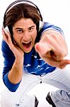Top View Of Shouting Male Enjoying Music And Pointing Stock Photo