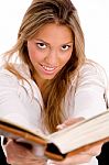 Top View Of Smiling Student With Book Looking At Camera Stock Photo