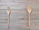 Top View Of Wood Spoon And Fork On Wooden Table Stock Photo
