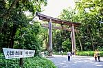 Tourists At Torii, The Entrance Leading To The Meiji Shrine Temple. Shibuya, Tokyo Stock Photo