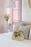 Tray Of Crochet On Bed With Pillows In Bedroom Stock Photo