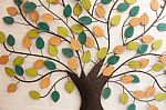 Tree With Colorful Leaves On White Wall Stock Photo