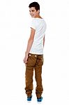 Trendy Young Boy Turning Back Stock Photo