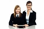 Tutor And Student Duo Operating Tablet Pc Stock Photo