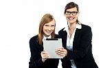 Tutor With Student Holding Portable Tablet Pc Stock Photo