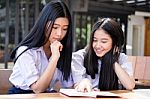 Two Asia Thai High School Student Uniform Best Friends Beautiful Girl Reading Book Stock Photo