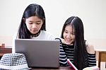Two Asia Thai High School Student Uniform Best Friends Beautiful Girl Using Her Laptop Stock Photo