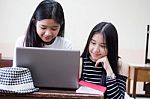 Two Asia Thai High School Student Uniform Best Friends Beautiful Girl Using Her Laptop Stock Photo