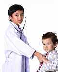 Two Boys Playing A Doctor Stock Photo
