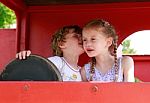 Two Children Whispering Stock Photo