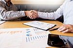 Two Confident Business Man Shaking Hands During A Meeting In The Stock Photo