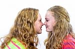 Two Dutch Teenage Girls Noses Make Contact Stock Photo