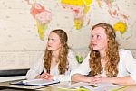 Two Female  Students In Classroom With  World Chart Stock Photo