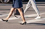 Two Pedestrians Walking Stock Photo