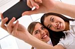 Two Smiling Young Women Taking Self Portrait Stock Photo