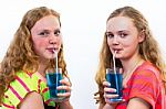 Two Teenagers Drink Blue Soda Stock Photo