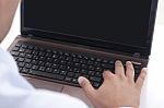 Typing On The Laptop Stock Photo