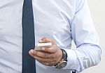 Use A Smartphone In The Office Stock Photo