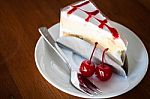 Vanilla Cake Topping With Cherry Sauce Stock Photo