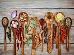 Various Of Spices And Herbs In Wooden Spoons. Flat Lay Of Spices Stock Photo