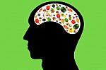 Vegetables And Fruits In Head On Green Background Stock Photo