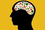 Vegetables And Fruits In Head On Yellow Background Stock Photo