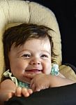 Very Happy Infant In Carseat Stock Photo