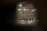 View Over Bukchon Hanok Village Through Wall Hole, Seoul Stock Photo