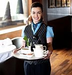 Waitress Posing With Tea For Guests Stock Photo
