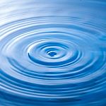 Water Drop Falling Into Water Making A Perfect Droplet Splash Stock Photo